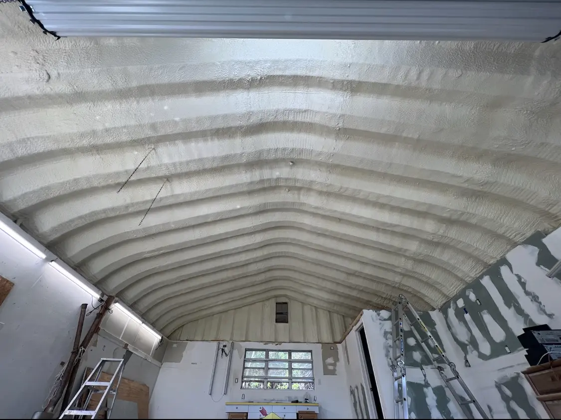 Spray polyurethane foam applied to the underside of a metal roof deck in Suffern